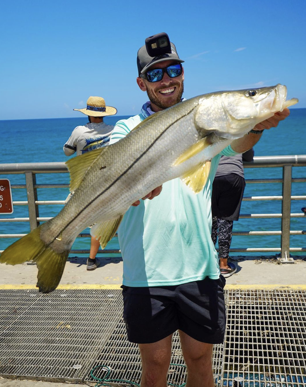 Ryan Morie Catching a Snook from the pier